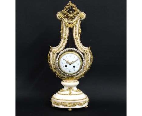 A 19thC. Louis XVI style ormolu mounted white marble striking lyre mantle clock with diamante faced pendulum, 528mm tall x 21