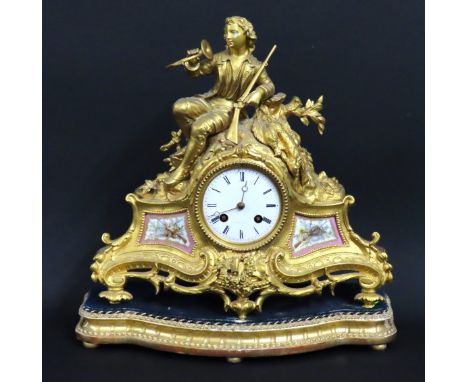 A 19thC. French gilt striking mantle clock with hunting theme Sevres inserts, movement HFC, Paris set on gilded, velvet plint