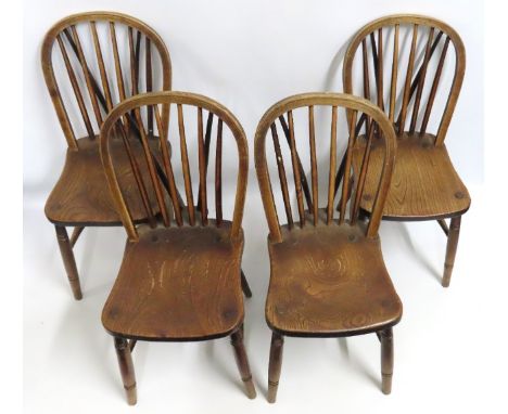 Four 19thC. elm seated Windsor stick back farmhouse chairs, one lacking rear stretcher, twinned with two similar wheel back, 