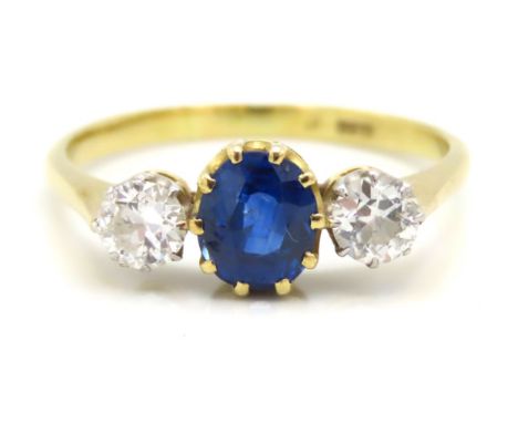 An 18ct gold sapphire & diamond ring set with approx. 0.5ct of diamond, sapphire 1.35ct, 7mm x 5.5mm, 3.1g, size R/S