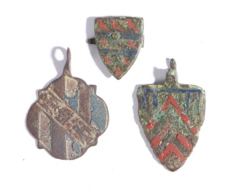 Three 14th century horse harness pendants, English, circa 1350-1400  Each of copper-alloy with red enamel and hanging loop, o