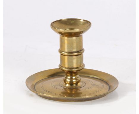 A George I brass lantern candlestick, circa 1720The straight-sided socket with mid-fillet and integral flared sconce, screwed