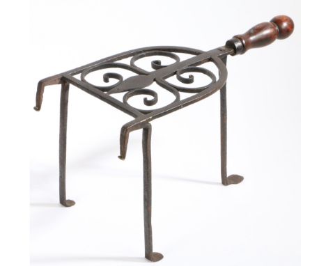 An early to mid-18th century wrought iron bar-grate trivet, with rare maker’s initials, English, circa 1700-30  The arched to