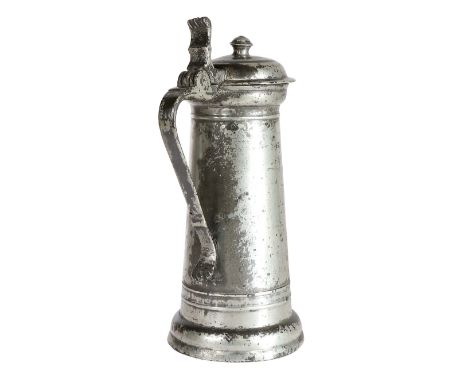 A good James I pewter flagon, circa 1610-20  The tapering drum with single narrow fillet below collar and matching twin-fille