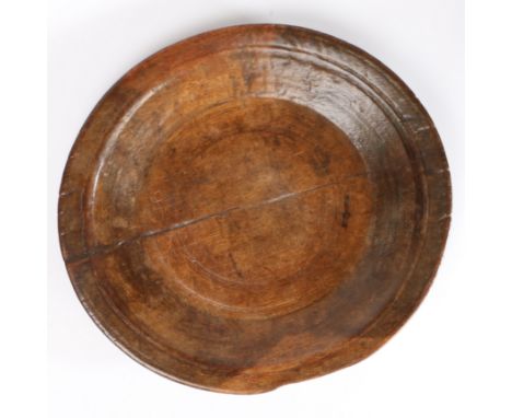 A shallow sycamore dairy bowl/platter, circa 1800  With decorative ring -urned gently sloping sides and flat base, diameter 4