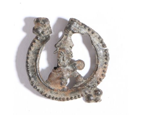 A 14th century pewter pilgrim badge, from the Shrine of Thomas Becket, Canterbury, circa 1350  Depicts the mitred head of the