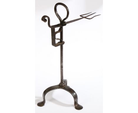 A George III wrought iron standing bird spit, circa 1790  The fork of three tines, rising and falling on a stem topped by a s