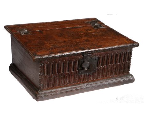 A James I boarded oak desk box, circa 1620  Having a gently sloping top, the one-piece hinged lid attached to the slender rea