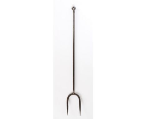 A good and heavy George III wrought iron log fork, circa 1800  Of two tines, and having a long stem topped by a reeded ball f