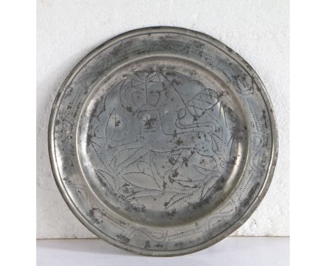 A rare George II pewter wrigglework plate, Hampshire, circa 1735  Having a single reed rim designed with geometric motifs, th