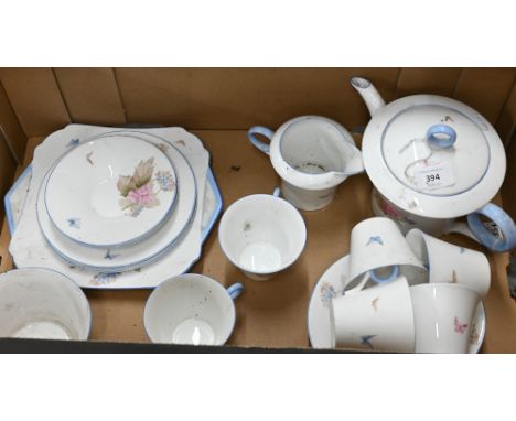 A Shelley china Art Deco tea service, printed with floral design and butterflies, 23 pieces including teapot