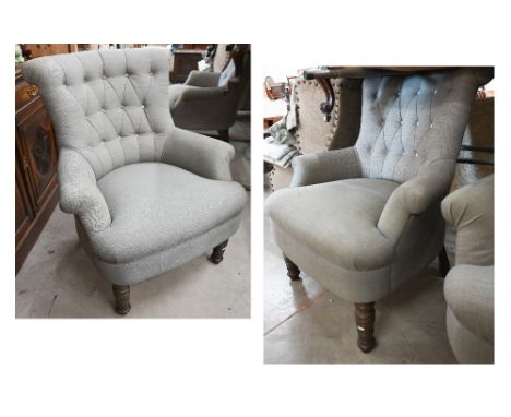 A pair of modern button back armchairs in grey fabric with turned front legs (a/f) 