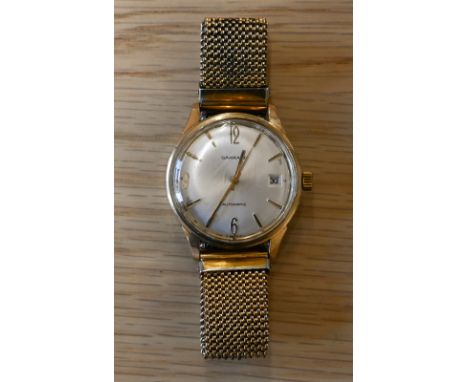 A vintage Garrards 9ct gold gents manual wristwatch, the oyster dial with gilt Arabic and baton markers, 3 o'clock date apert