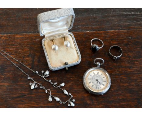 A Victorian silver pocket watch with foliate chased case, decorative silvered dial with blue steel handles, an Arts &amp; Cra
