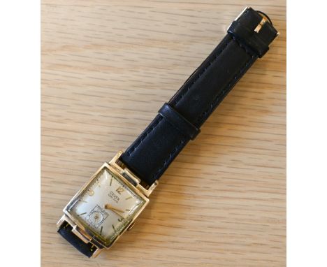 An Art Deco gents Gruen gold plated tank style wristwatch, circa 1930's, manual with convex champagne dial with gilt markers 