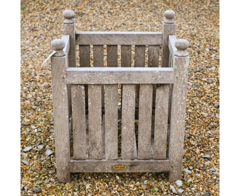 A weathered slatted Chic Teak garden planter, 45 cm x 45 cm x 54 cm h
