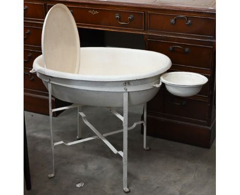 A Victorian painted papier-maché baby bath on metal stand, 56 cm high to/w a set of baby-scales (2)