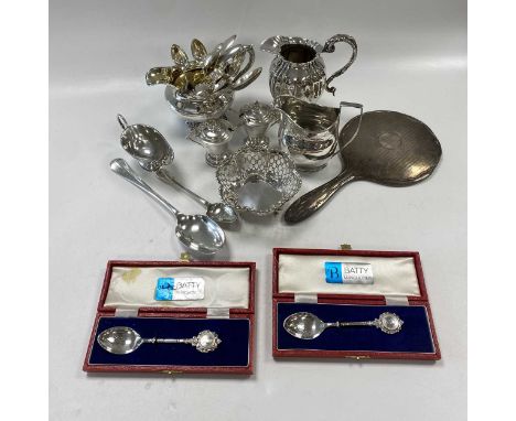 A collection of silverware including flatware, cruets cream jugs etc.,1067g (37.6ozt) gross weighable silver, together with a