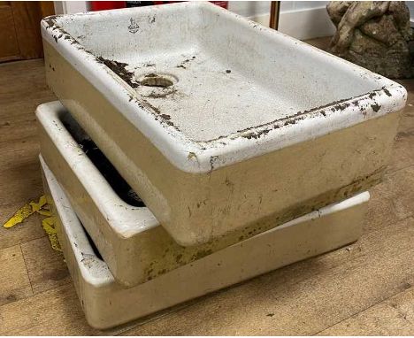 A Royal Doulton ceramic Belfast sink, heavily crazed 16cm x 61cm x 41cm, together with two other ceramic sinks (previously us