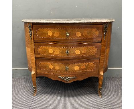 A Louis XVI style floral marquetry and gilt metal three drawer serpentine commode, with shaped grey speckled marble top (escu