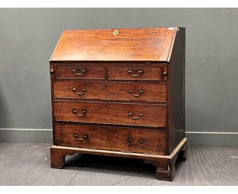 A George III mahogany bureau, the fall front abover two short and three long drawers114 x 103 x 58cmSignificant staining to t