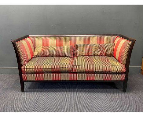 An Art Deco style ebonised three seat sofa, with cut red and silver velvet upholstery, 83cm x 180cm x 77cm
