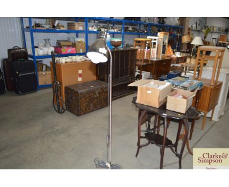 A floor standing adjustable reading lamp