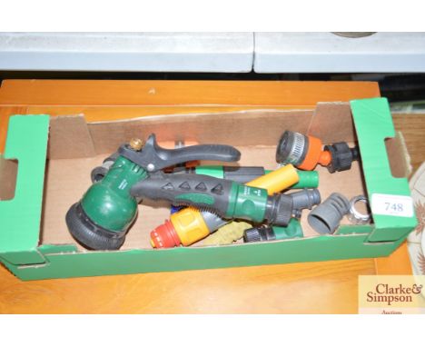 A box containing a small quantity of hose pipe fittings