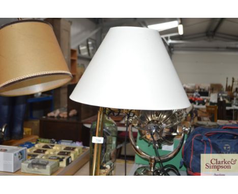 A standard lamp and shade
