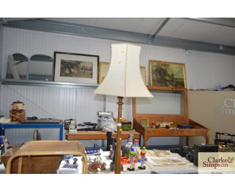 A mahogany turned standard lamp and shade