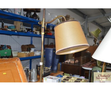 A brass standard lamp and shade 