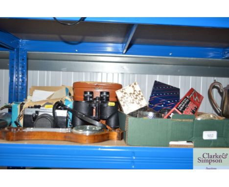 A box containing various sundry items; a small barometer, Praktica camera, a pair of Viper 8 x 40 binoculars etc.