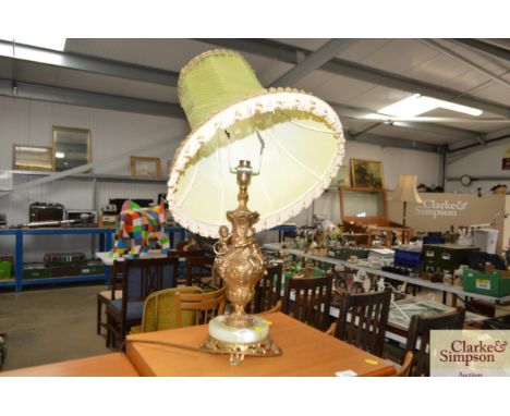 A brass and onyx figural decorated table lamp and shade