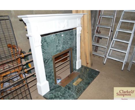 A marble fire surround and grate