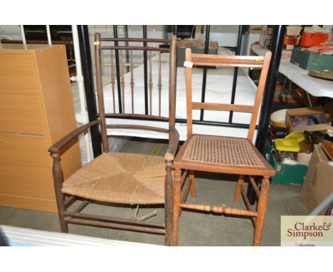 A cane seated chair together with a string seated stick back armchair