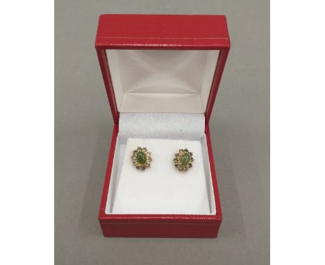 A pair of 9 ct gold and jade earrings
