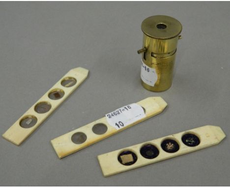 A 19th century field pocket microscope with slides