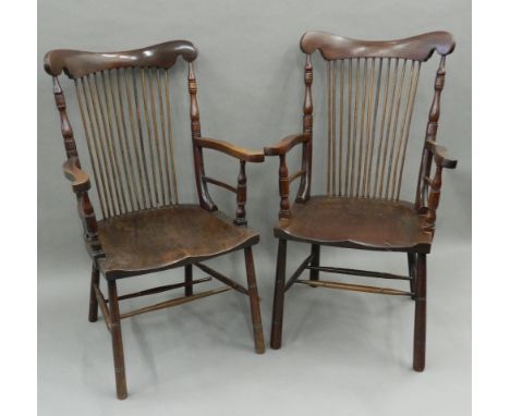 A pair of 19th century mahogany stick back open armchairs