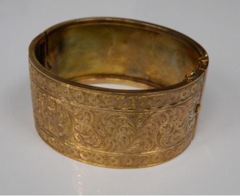 A 9 ct gold cuff bangle (22.2 grammes)