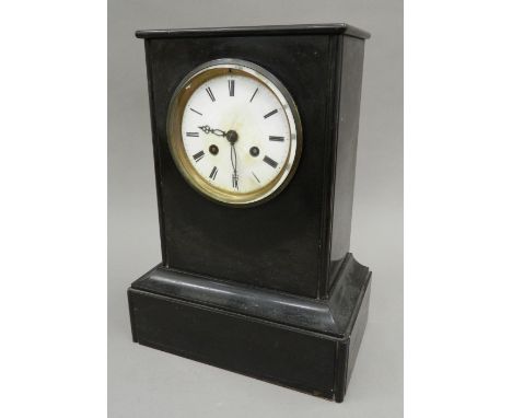 A Victorian black slate mantel clock