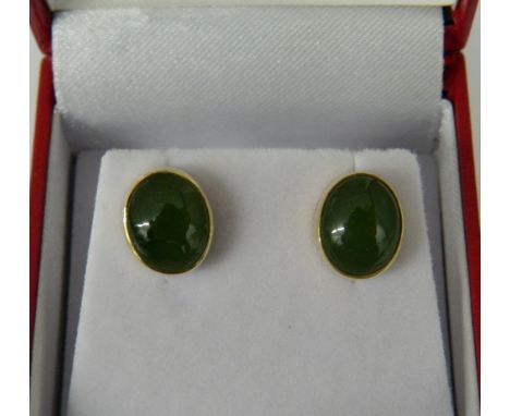 A pair of 14 ct gold jade earrings 