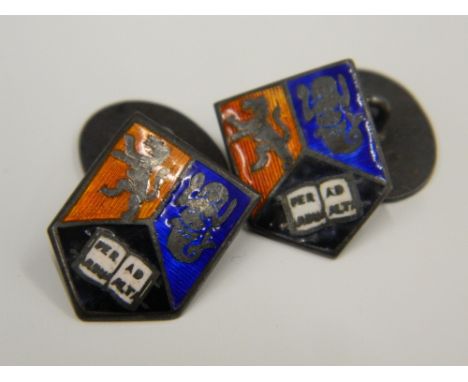 A pair of silver and enamel heraldic cufflinks