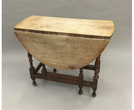 An oak gate leg table and a small gate leg table