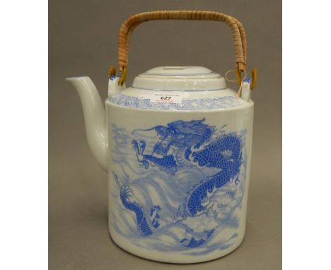 A large blue and white teapot