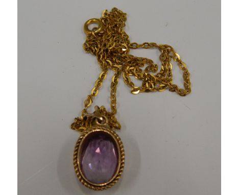 A 9 ct gold amethyst pendant on chain (4.9 grammes total weight)