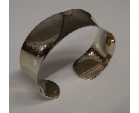 A silver cuff bangle (24.9 grammes)