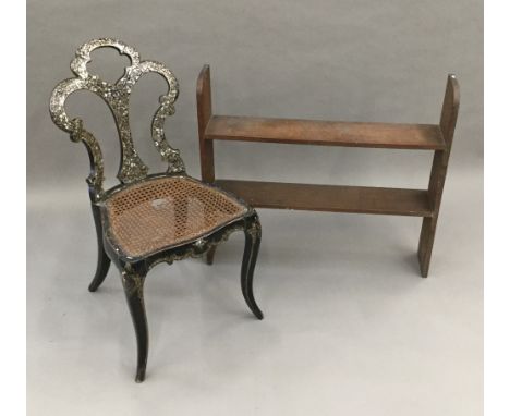 A Victorian mother-of-pearl inlaid cane seated bedroom chair and an oak hanging shelf