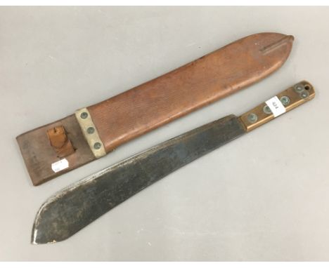 A vintage machete in a leather sheath