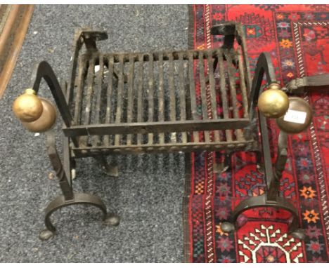 A 19th century fire grate and a pair of fire dogs