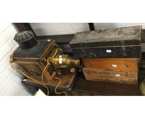 A Victorian magic lantern projector and a quantity of slides